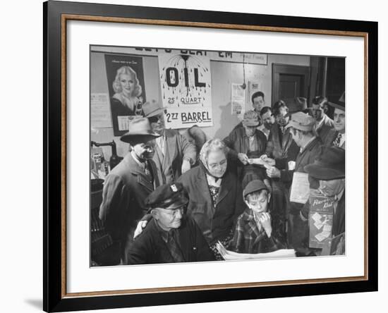 Town Residents Standing in Gas Station, Discussing Problems Caused by Oil Boom-Bernard Hoffman-Framed Photographic Print