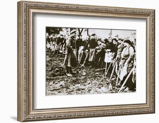 Townsfolk wait to scour the fields for potatoes left by farmers, Germany, World War I, c1914-c1918-Unknown-Framed Photographic Print