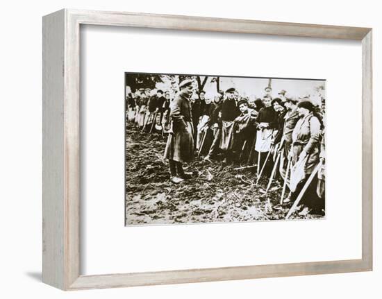 Townsfolk wait to scour the fields for potatoes left by farmers, Germany, World War I, c1914-c1918-Unknown-Framed Photographic Print