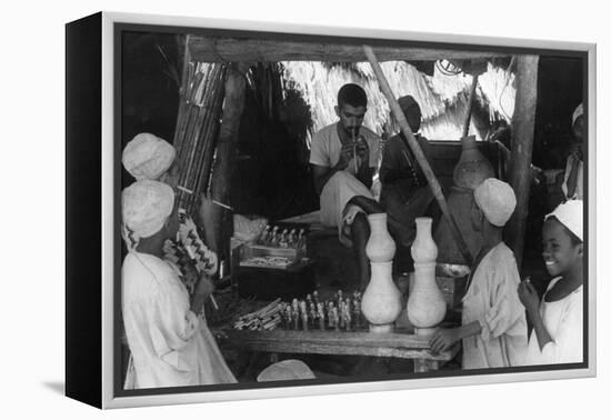 Toy Seller, Oman-null-Framed Premier Image Canvas