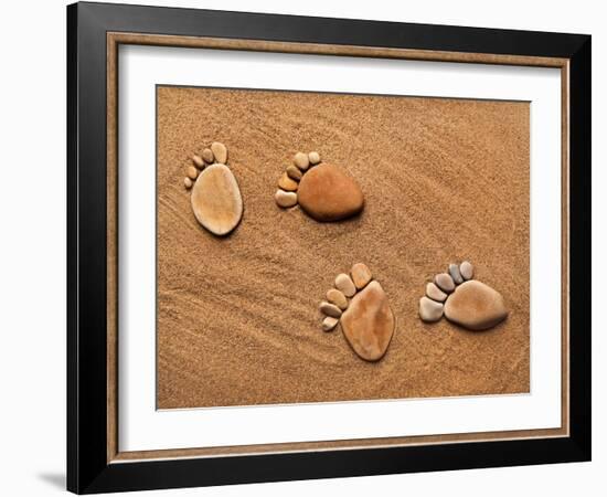 Trace Feet Steps Made Of A Pebble Stone On The Sea Sand Backdrop-Madlen-Framed Photographic Print