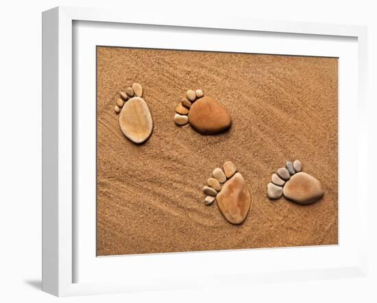 Trace Feet Steps Made Of A Pebble Stone On The Sea Sand Backdrop-Madlen-Framed Photographic Print