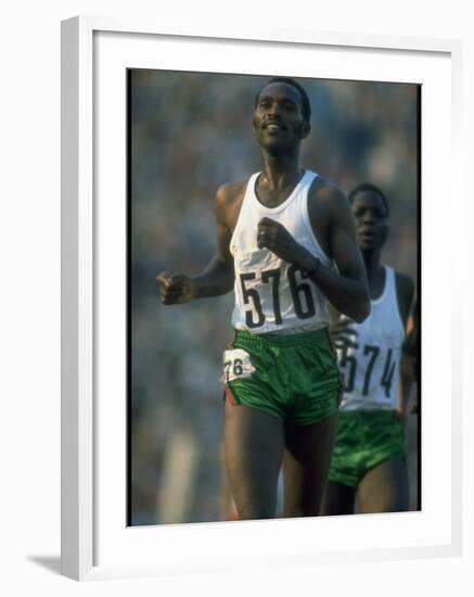 Track Athlete Kip Keino in Action at the Summer Olympics-John Dominis-Framed Premium Photographic Print