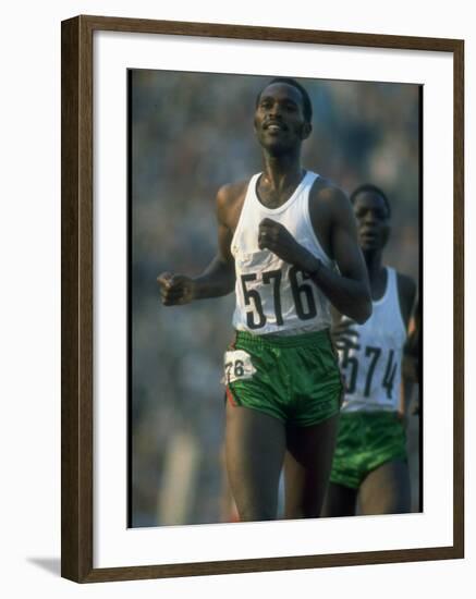 Track Athlete Kip Keino in Action at the Summer Olympics-John Dominis-Framed Premium Photographic Print