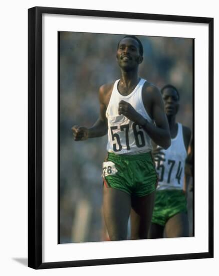 Track Athlete Kip Keino in Action at the Summer Olympics-John Dominis-Framed Premium Photographic Print