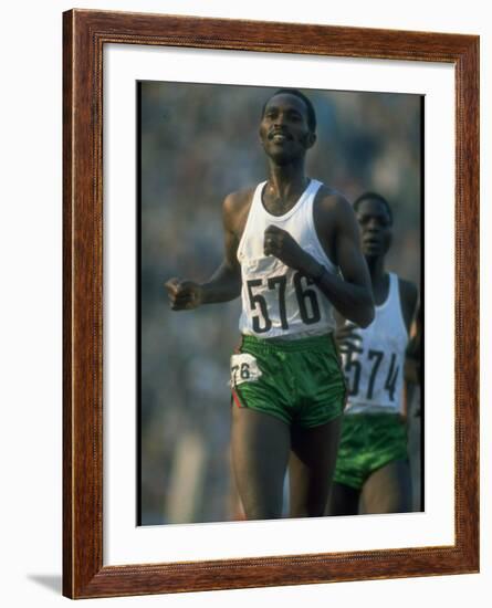 Track Athlete Kip Keino in Action at the Summer Olympics-John Dominis-Framed Premium Photographic Print