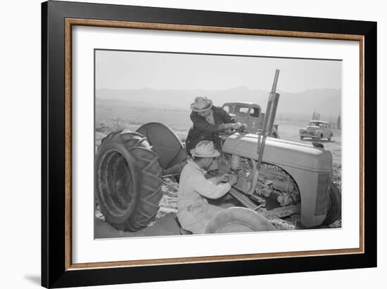 Tractor Repair: Driver Benji Iguchi, Mechanic Henry Hanawa, Manzanar Relocation Center, California-Ansel Adams-Framed Art Print