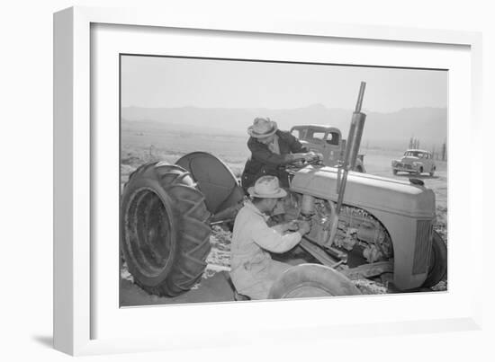 Tractor Repair: Driver Benji Iguchi, Mechanic Henry Hanawa, Manzanar Relocation Center, California-Ansel Adams-Framed Art Print