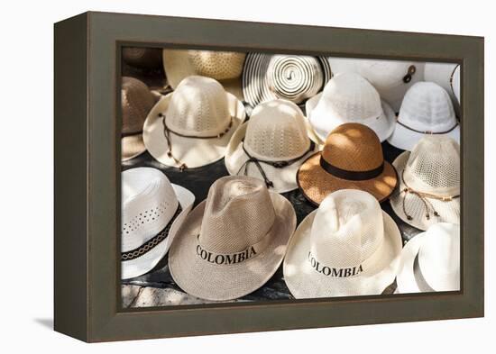 Traditional Panama hats for sale at a street market in Cartagena, Colombia, South America-Alex Treadway-Framed Premier Image Canvas
