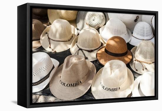 Traditional Panama hats for sale at a street market in Cartagena, Colombia, South America-Alex Treadway-Framed Premier Image Canvas