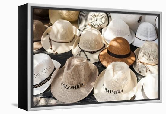 Traditional Panama hats for sale at a street market in Cartagena, Colombia, South America-Alex Treadway-Framed Premier Image Canvas