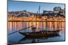 Traditional Rabelo boat designed to carry wine down Douro river with city skyline behind, Porto, Po-Stefano Politi Markovina-Mounted Photographic Print