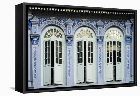 Traditional shophouse windows open out onto a street in the Orchard Road neighborhood in Singapore-Logan Brown-Framed Premier Image Canvas