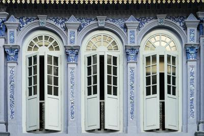 Traditional Shophouse Windows Open Out Onto A Street In The