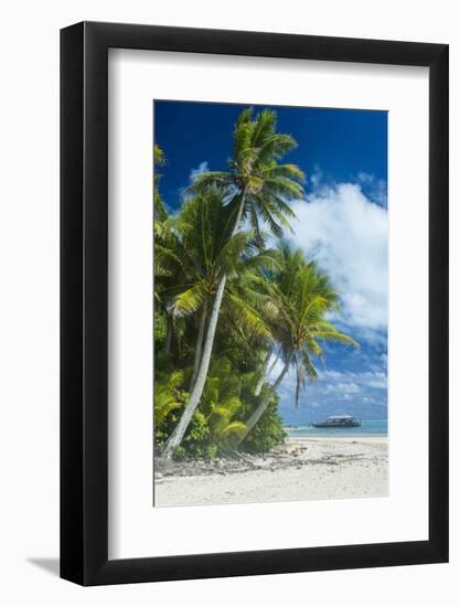 Traditional wood carved boat in the Aitutaki lagoon, Rarotonga and the Cook Islands, South Pacific,-Michael Runkel-Framed Photographic Print