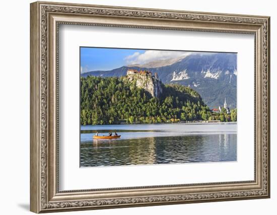 Traditional wooden pletnja rowing boat to ferry tourists to St. Mary's Church of Assumption on the-Miva Stock-Framed Photographic Print