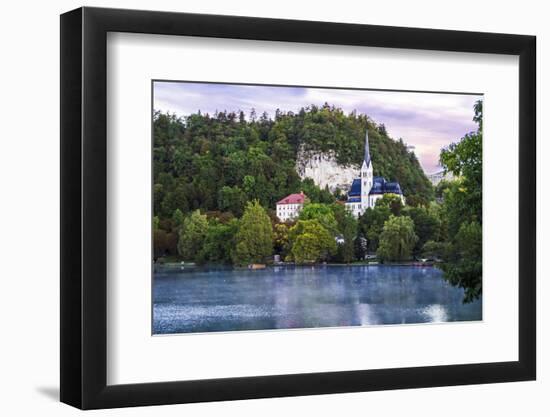 Traditional wooden pletnja rowing boat used to ferry tourists to St. Mary's Church of Assumption on-Miva Stock-Framed Photographic Print