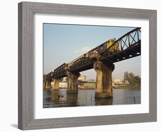 Train Crossing the River Kwai Bridge at Kanchanburi in Thailand, Southeast Asia-Charcrit Boonsom-Framed Photographic Print