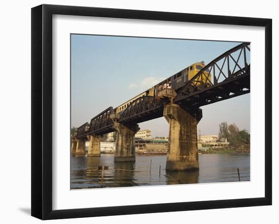 Train Crossing the River Kwai Bridge at Kanchanburi in Thailand, Southeast Asia-Charcrit Boonsom-Framed Photographic Print