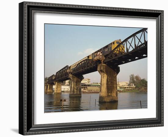 Train Crossing the River Kwai Bridge at Kanchanburi in Thailand, Southeast Asia-Charcrit Boonsom-Framed Photographic Print