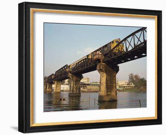 Train Crossing the River Kwai Bridge at Kanchanburi in Thailand, Southeast Asia-Charcrit Boonsom-Framed Photographic Print