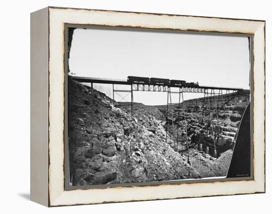 Train Traveling over Santa Fe Railroad Bridge, Which is Built over Canyon Diablo-null-Framed Premier Image Canvas