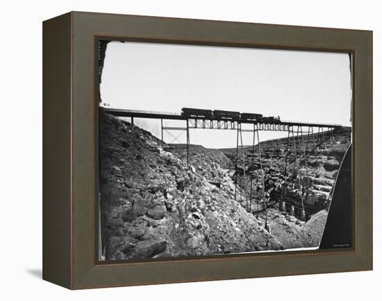 Train Traveling over Santa Fe Railroad Bridge, Which is Built over Canyon Diablo-null-Framed Premier Image Canvas