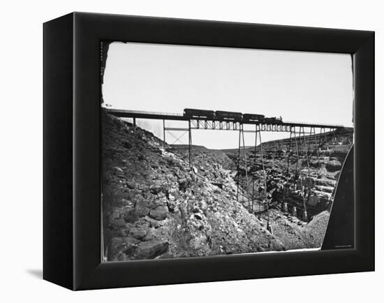 Train Traveling over Santa Fe Railroad Bridge, Which is Built over Canyon Diablo-null-Framed Premier Image Canvas