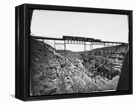 Train Traveling over Santa Fe Railroad Bridge, Which is Built over Canyon Diablo-null-Framed Premier Image Canvas