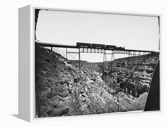 Train Traveling over Santa Fe Railroad Bridge, Which is Built over Canyon Diablo-null-Framed Premier Image Canvas