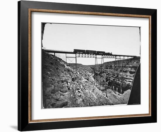 Train Traveling over Santa Fe Railroad Bridge, Which is Built over Canyon Diablo-null-Framed Premium Photographic Print