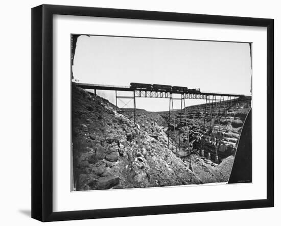 Train Traveling over Santa Fe Railroad Bridge, Which is Built over Canyon Diablo-null-Framed Premium Photographic Print