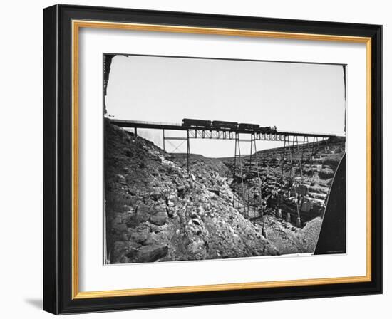 Train Traveling over Santa Fe Railroad Bridge, Which is Built over Canyon Diablo-null-Framed Photographic Print