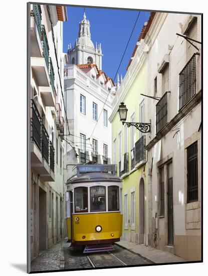 Tram (Electricos) Along Rua Das Escolas Gerais with Tower of Sao Vicente de Fora, Lisbon, Portugal-Stuart Black-Mounted Photographic Print