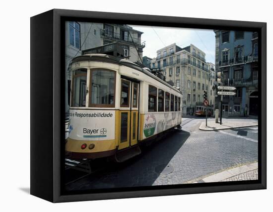 Tram in the Baixa District, Lisbon, Portugal-Neale Clarke-Framed Premier Image Canvas