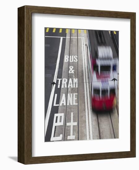 Tram Passing Along Des Voeux Road Central, Central, Hong Kong, China-Ian Trower-Framed Photographic Print