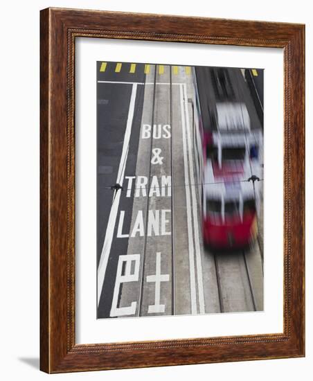 Tram Passing Along Des Voeux Road Central, Central, Hong Kong, China-Ian Trower-Framed Photographic Print