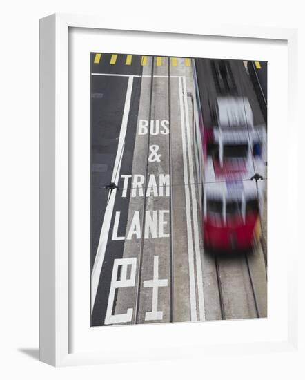 Tram Passing Along Des Voeux Road Central, Central, Hong Kong, China-Ian Trower-Framed Photographic Print