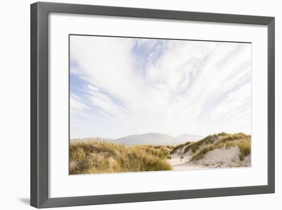 Tramore Beach, Kiltooris, Portnoo, Donegal, Ireland: Woman Walking Through The Dunes Towards Beach-Axel Brunst-Framed Photographic Print