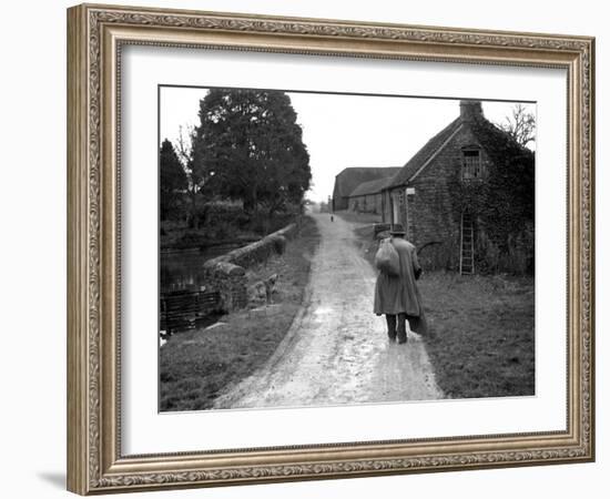 Tramp Named John Walpole Walking in Village Carrying Bag over His Shoulder-null-Framed Photographic Print
