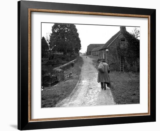 Tramp Named John Walpole Walking in Village Carrying Bag over His Shoulder-null-Framed Photographic Print