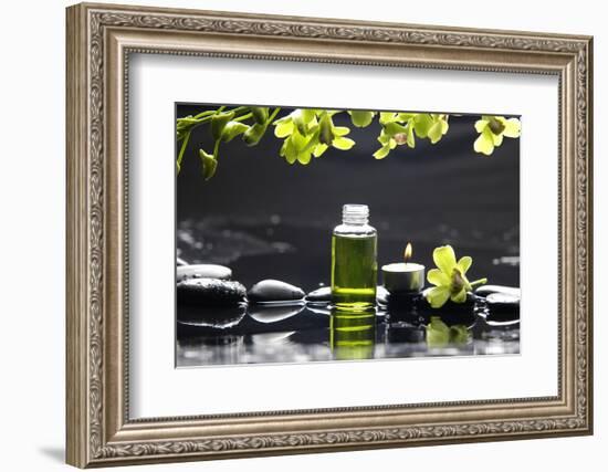 Tranquil Spa Scene - Massage Oil and Candle on Black Stones with Green Orchid-crystalfoto-Framed Photographic Print