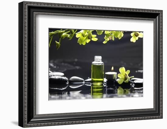 Tranquil Spa Scene - Massage Oil and Candle on Black Stones with Green Orchid-crystalfoto-Framed Photographic Print