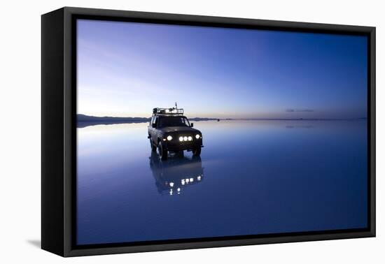 Travelers Drive their Suv across a the Salar De Uyuni, a Flooded Salt Flat, in Bolivia-Sergio Ballivian-Framed Premier Image Canvas