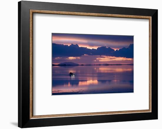 Travelers Drive their Suv across a the Salar De Uyuni, a Flooded Salt Flat, in Bolivia-Sergio Ballivian-Framed Photographic Print