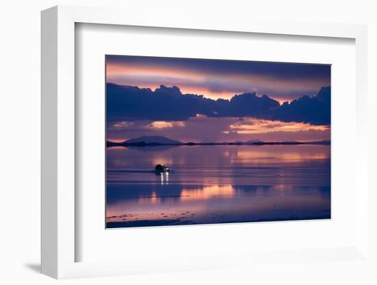 Travelers Drive their Suv across a the Salar De Uyuni, a Flooded Salt Flat, in Bolivia-Sergio Ballivian-Framed Photographic Print