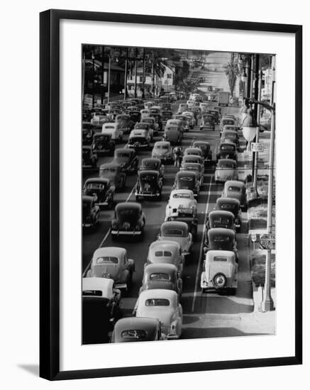 Traveling Through Rush Hour Traffic in Downtown Los Angeles-Loomis Dean-Framed Photographic Print