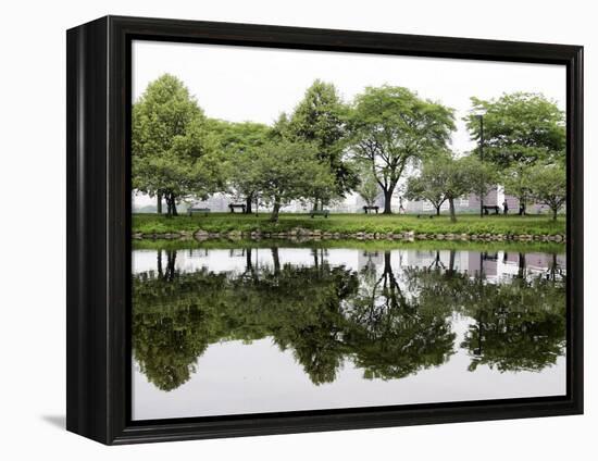 Trees are Reflected in Still Water on the Esplanade Along the Charles River in Boston-null-Framed Premier Image Canvas