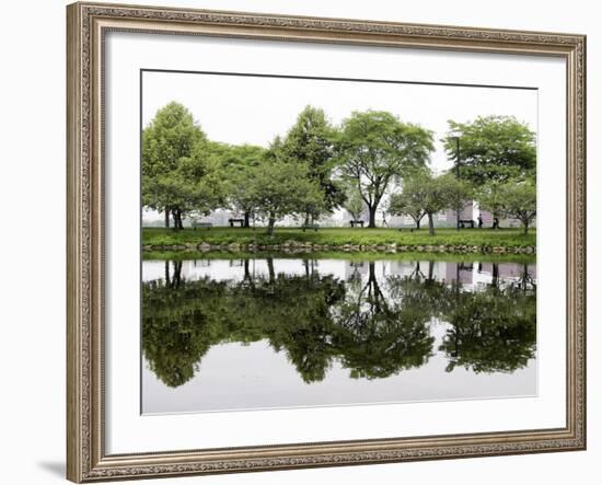 Trees are Reflected in Still Water on the Esplanade Along the Charles River in Boston-null-Framed Photographic Print