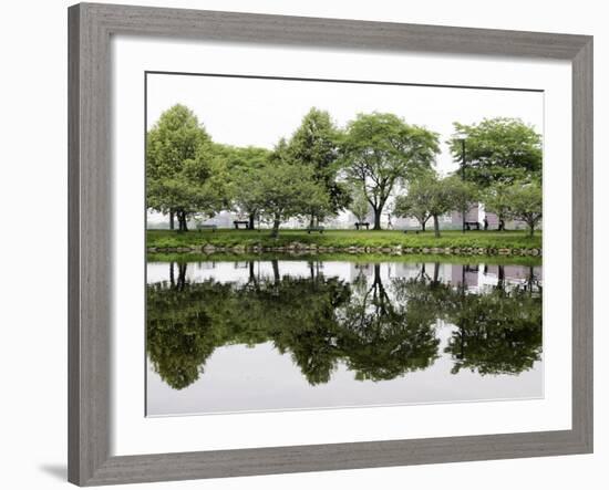 Trees are Reflected in Still Water on the Esplanade Along the Charles River in Boston-null-Framed Photographic Print